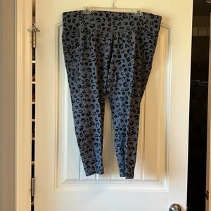 Lane Bryant calf length athletic pants with pocket at waist.